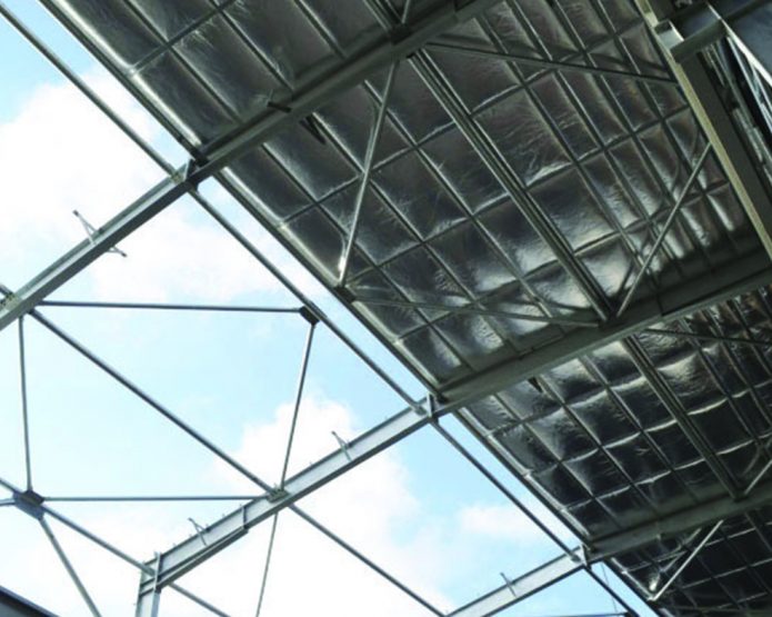 An image of the interior roof of a building that is mid construction.