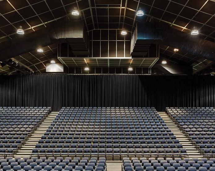 Compressed straw panel ceiling used in a performing arts centre